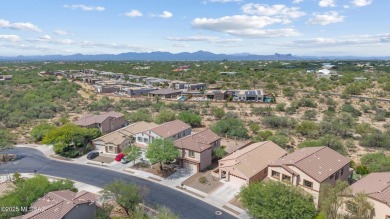 Located in Rancho Vistoso, this Elevation C Plan with Stone sits on The Golf Club at Vistoso in Arizona - for sale on GolfHomes.com, golf home, golf lot