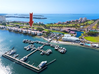 GORGEOUS & nestled on the golf greens with peaceful views, this on Isla Del Sol Yacht and Country Club in Florida - for sale on GolfHomes.com, golf home, golf lot