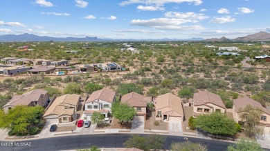 Located in Rancho Vistoso, this Elevation C Plan with Stone sits on The Golf Club at Vistoso in Arizona - for sale on GolfHomes.com, golf home, golf lot