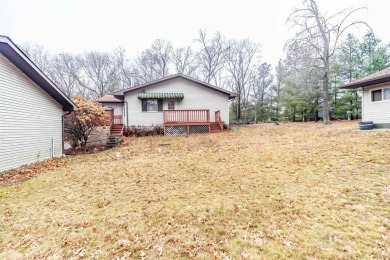 Spacious 3-Bedroom Home with Bonus Spaces and Ample Storage Near on Northern Bay Golf Resort and Marina in Wisconsin - for sale on GolfHomes.com, golf home, golf lot