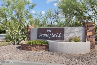 Located in Rancho Vistoso, this Elevation C Plan with Stone sits on The Golf Club at Vistoso in Arizona - for sale on GolfHomes.com, golf home, golf lot