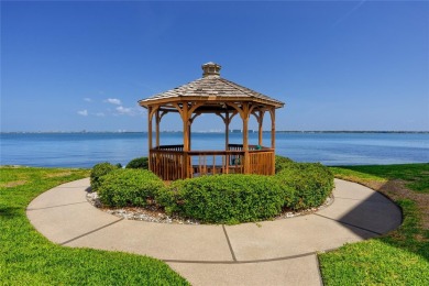 GORGEOUS & nestled on the golf greens with peaceful views, this on Isla Del Sol Yacht and Country Club in Florida - for sale on GolfHomes.com, golf home, golf lot