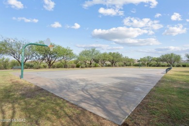 Located in Rancho Vistoso, this Elevation C Plan with Stone sits on The Golf Club at Vistoso in Arizona - for sale on GolfHomes.com, golf home, golf lot