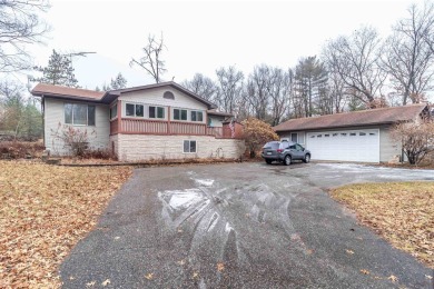 Spacious 3-Bedroom Home with Bonus Spaces and Ample Storage Near on Northern Bay Golf Resort and Marina in Wisconsin - for sale on GolfHomes.com, golf home, golf lot