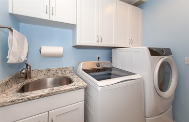 Paradise found on the 16th hole . . . a home designed for those on Plantation Golf and Country Club in Florida - for sale on GolfHomes.com, golf home, golf lot