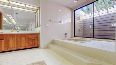 RARE AND DESIRABLE END UNIT ON AN OVERSIZED AND BEAUTIFULLY on East Lake Woodlands Country Club in Florida - for sale on GolfHomes.com, golf home, golf lot