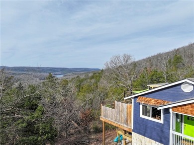 BREATHTAKING VIEWS of the lake and mountains year round!  This on Holiday Island Executive Golf Course in Arkansas - for sale on GolfHomes.com, golf home, golf lot