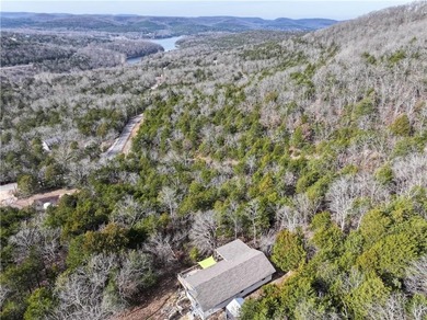 BREATHTAKING VIEWS of the lake and mountains year round!  This on Holiday Island Executive Golf Course in Arkansas - for sale on GolfHomes.com, golf home, golf lot