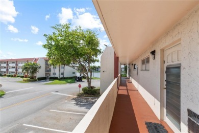 LUXURIOUS ISLAND STYLE 2BR/2BA with 17th hole PGA course green & on Hollybrook Golf and Tennis Club  in Florida - for sale on GolfHomes.com, golf home, golf lot