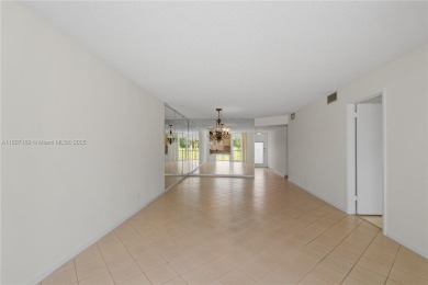 LUXURIOUS ISLAND STYLE 2BR/2BA with 17th hole PGA course green & on Hollybrook Golf and Tennis Club  in Florida - for sale on GolfHomes.com, golf home, golf lot