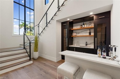 Contemporary coastal architecture with clean, modern lines is on The Moorings Country Club in Florida - for sale on GolfHomes.com, golf home, golf lot