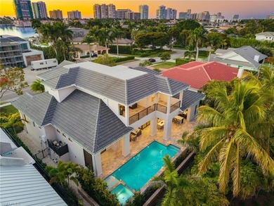 Contemporary coastal architecture with clean, modern lines is on The Moorings Country Club in Florida - for sale on GolfHomes.com, golf home, golf lot
