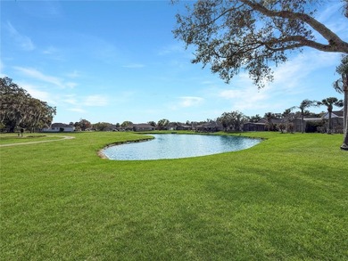 Welcome to this beautiful two-story home nestled inside the on Oaks National Golf Course in Florida - for sale on GolfHomes.com, golf home, golf lot