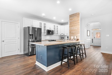 This beautifully-maintained 4-bedroom home with a welcoming on The Peninsula Club in North Carolina - for sale on GolfHomes.com, golf home, golf lot