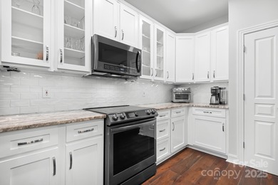 This beautifully-maintained 4-bedroom home with a welcoming on The Peninsula Club in North Carolina - for sale on GolfHomes.com, golf home, golf lot