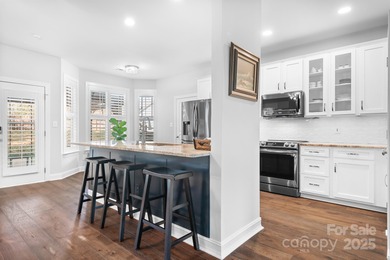 This beautifully-maintained 4-bedroom home with a welcoming on The Peninsula Club in North Carolina - for sale on GolfHomes.com, golf home, golf lot