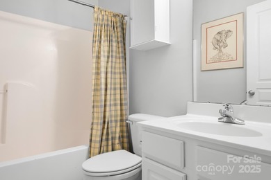 This beautifully-maintained 4-bedroom home with a welcoming on The Peninsula Club in North Carolina - for sale on GolfHomes.com, golf home, golf lot