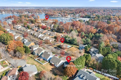 This beautifully-maintained 4-bedroom home with a welcoming on The Peninsula Club in North Carolina - for sale on GolfHomes.com, golf home, golf lot