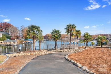 This beautifully-maintained 4-bedroom home with a welcoming on The Peninsula Club in North Carolina - for sale on GolfHomes.com, golf home, golf lot