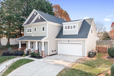 This beautifully-maintained 4-bedroom home with a welcoming on The Peninsula Club in North Carolina - for sale on GolfHomes.com, golf home, golf lot