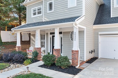 This beautifully-maintained 4-bedroom home with a welcoming on The Peninsula Club in North Carolina - for sale on GolfHomes.com, golf home, golf lot