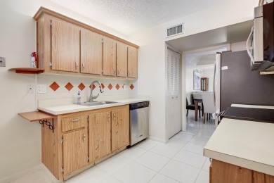 WELCOME TO THIS NATURALLY BRIGHT CONDO WITH SOUTH FACING VIEWS on Poinciana Golf Club in Florida - for sale on GolfHomes.com, golf home, golf lot