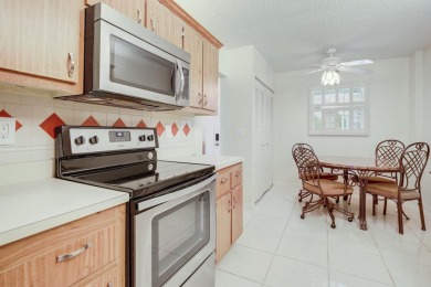 WELCOME TO THIS NATURALLY BRIGHT CONDO WITH SOUTH FACING VIEWS on Poinciana Golf Club in Florida - for sale on GolfHomes.com, golf home, golf lot