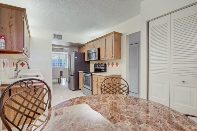WELCOME TO THIS NATURALLY BRIGHT CONDO WITH SOUTH FACING VIEWS on Poinciana Golf Club in Florida - for sale on GolfHomes.com, golf home, golf lot