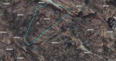 Beautiful wooded lot with a seasonal lake view in the gated on Hide-A-Way Hills Club in Ohio - for sale on GolfHomes.com, golf home, golf lot