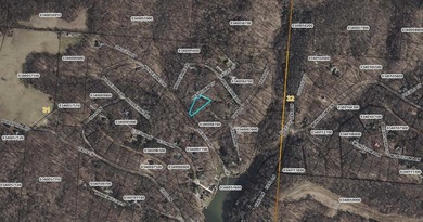Beautiful wooded lot with a seasonal lake view in the gated on Hide-A-Way Hills Club in Ohio - for sale on GolfHomes.com, golf home, golf lot