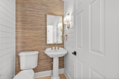 This beautifully renovated home sits along the Ocean #5 fairway on Country Club of Landfall in North Carolina - for sale on GolfHomes.com, golf home, golf lot