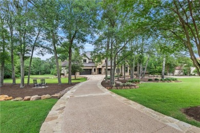 This custom estate sits on a rare 1.4-acre wooded lot backing to on The Traditions Club At Texas A and M in Texas - for sale on GolfHomes.com, golf home, golf lot