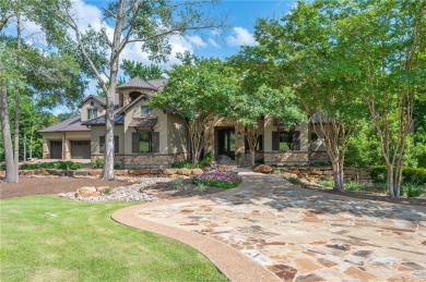 This custom estate sits on a rare 1.4-acre wooded lot backing to on The Traditions Club At Texas A and M in Texas - for sale on GolfHomes.com, golf home, golf lot