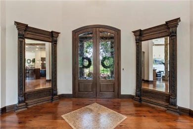 This custom estate sits on a rare 1.4-acre wooded lot backing to on The Traditions Club At Texas A and M in Texas - for sale on GolfHomes.com, golf home, golf lot