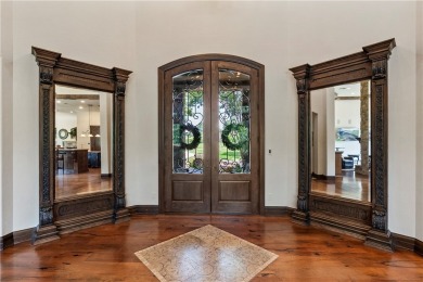 This custom estate sits on a rare 1.4-acre wooded lot backing to on The Traditions Club At Texas A and M in Texas - for sale on GolfHomes.com, golf home, golf lot