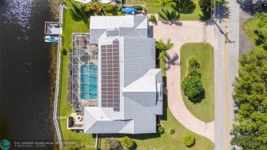 Unique Key West-style waterfront retreat in prestigious Golf on Plantation Preserve Golf Course in Florida - for sale on GolfHomes.com, golf home, golf lot