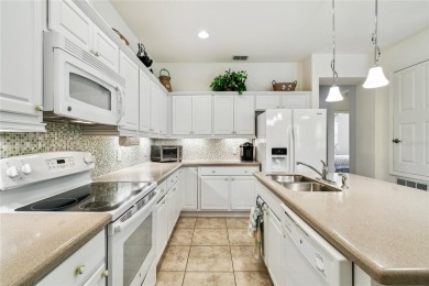 Enjoy gorgeous and relaxing WATER VIEWS from this beautifully on Stonegate Golf Club in Florida - for sale on GolfHomes.com, golf home, golf lot