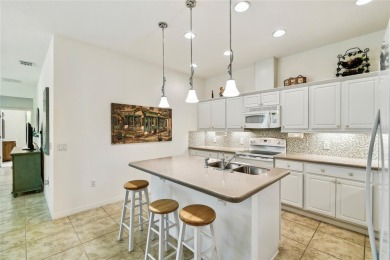 Enjoy gorgeous and relaxing WATER VIEWS from this beautifully on Stonegate Golf Club in Florida - for sale on GolfHomes.com, golf home, golf lot