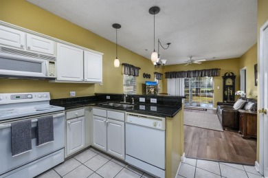1st-floor end unit, 2-bedroom 2-bathroom cozy condo with on Palmetto Greens Golf and Country Club in South Carolina - for sale on GolfHomes.com, golf home, golf lot