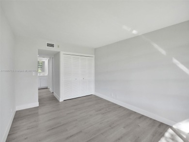 Discover luxurious living in this fully renovated 3-bedroom on Palm-Aire Country Club and Resort - The Oaks in Florida - for sale on GolfHomes.com, golf home, golf lot