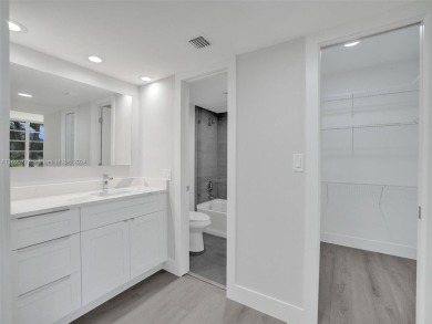 Discover luxurious living in this fully renovated 3-bedroom on Palm-Aire Country Club and Resort - The Oaks in Florida - for sale on GolfHomes.com, golf home, golf lot