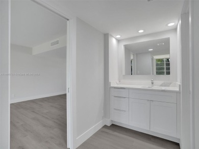 Discover luxurious living in this fully renovated 3-bedroom on Palm-Aire Country Club and Resort - The Oaks in Florida - for sale on GolfHomes.com, golf home, golf lot