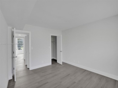 Discover luxurious living in this fully renovated 3-bedroom on Palm-Aire Country Club and Resort - The Oaks in Florida - for sale on GolfHomes.com, golf home, golf lot