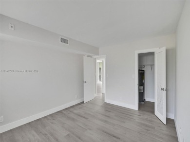 Discover luxurious living in this fully renovated 3-bedroom on Palm-Aire Country Club and Resort - The Oaks in Florida - for sale on GolfHomes.com, golf home, golf lot