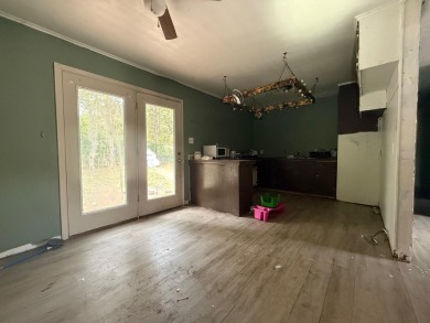 This 3-bedroom, 2-bath home sits on a large corner lot and on Cherokee Village North Course in Arkansas - for sale on GolfHomes.com, golf home, golf lot