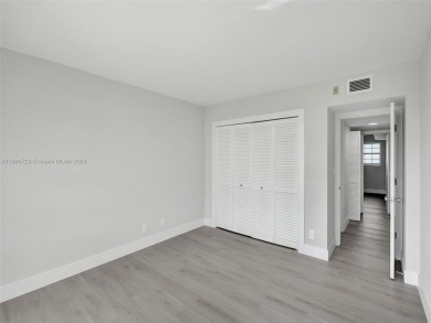 Discover luxurious living in this fully renovated 3-bedroom on Palm-Aire Country Club and Resort - The Oaks in Florida - for sale on GolfHomes.com, golf home, golf lot
