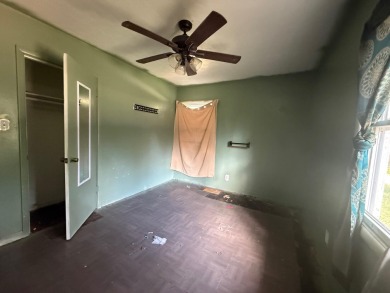 This 3-bedroom, 2-bath home sits on a large corner lot and on Cherokee Village North Course in Arkansas - for sale on GolfHomes.com, golf home, golf lot