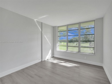 Discover luxurious living in this fully renovated 3-bedroom on Palm-Aire Country Club and Resort - The Oaks in Florida - for sale on GolfHomes.com, golf home, golf lot