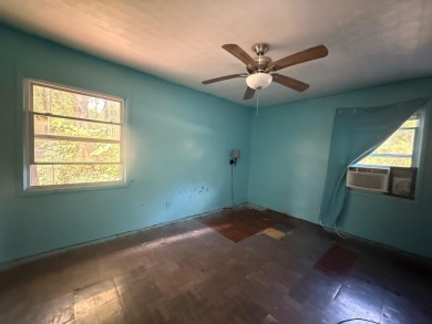 This 3-bedroom, 2-bath home sits on a large corner lot and on Cherokee Village North Course in Arkansas - for sale on GolfHomes.com, golf home, golf lot