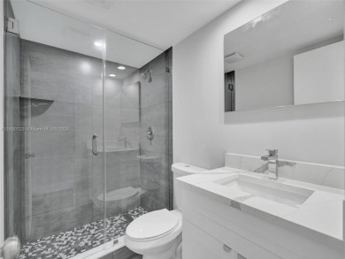 Discover luxurious living in this fully renovated 3-bedroom on Palm-Aire Country Club and Resort - The Oaks in Florida - for sale on GolfHomes.com, golf home, golf lot